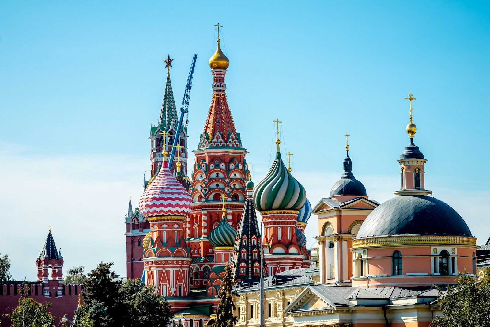 Saint Basil's Cathedral with colorful onion domes against a clear blue sky in Moscow