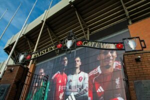 Paisley gateway entrance with football players mural